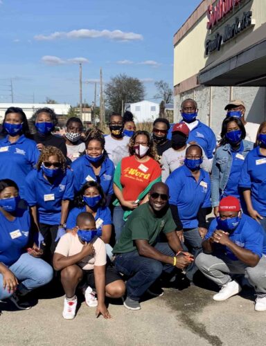 Group Of Volunteers At Farmers To Families Ensley Event