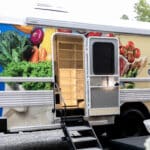 Side door of the Mercy Deliverance Ministries Mobile Grocery Store bus open